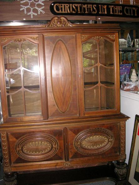 A circa 1920's walnut China Cabinet from H.E. Shaw Furniture Co. Manufacturers from Grand Rapids, Michigan.